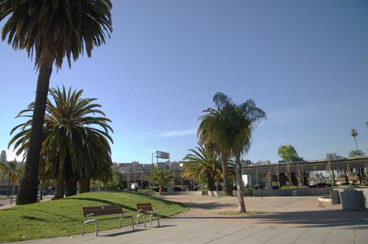 A small park across the street from the Grand Lake Theater in Oakland under the 580 Freeway.