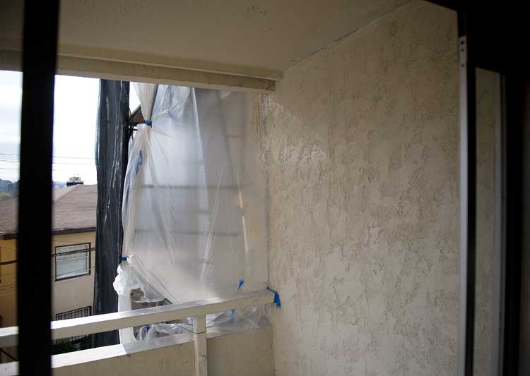 The first coat of paint through the balcony door.