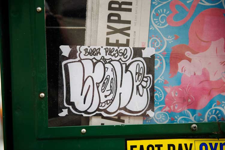 A sidewalk news box on Grand Avenue in the Grand Lake theater area of Oakland.