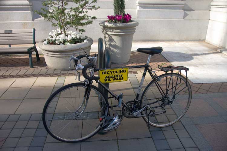 Biking against big oil in front of Oakland City Hall.