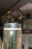 Artsy-fartsy shot of wine glass in parlor car.