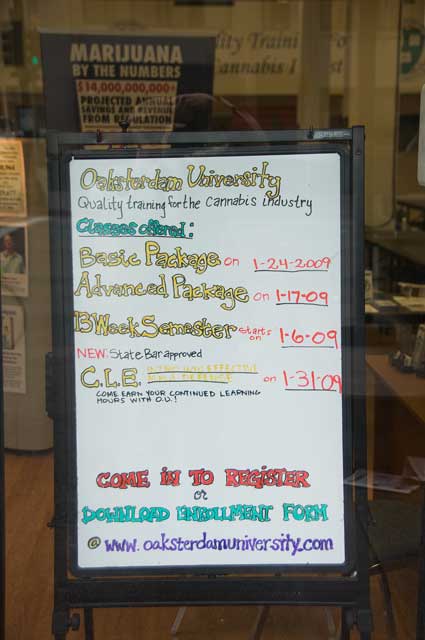 A sign in the Oaksterdam University window on Broadway in Oakland.