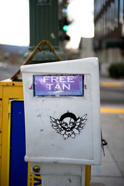 A sidewalk news box off Grand Avenue in Oakland.