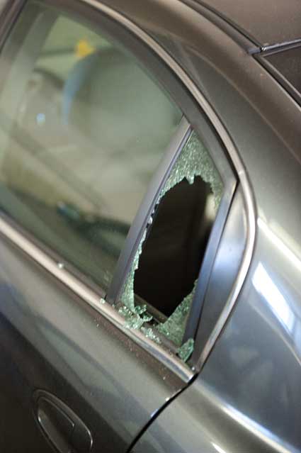 A vandalized car in our apartment building garage this morning.