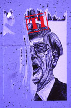 Torn poster on a wall in San Francisco.