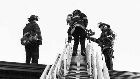 Firemen on Broadway in Oakland.